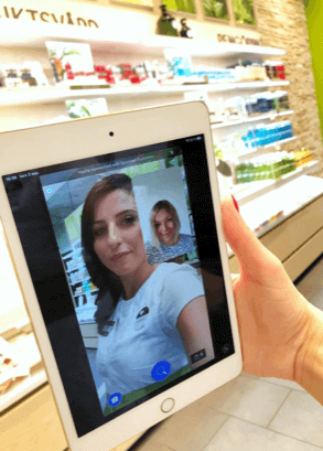 A photo of a customer video chatting with an Yves Rocher consultant for a remote product demo