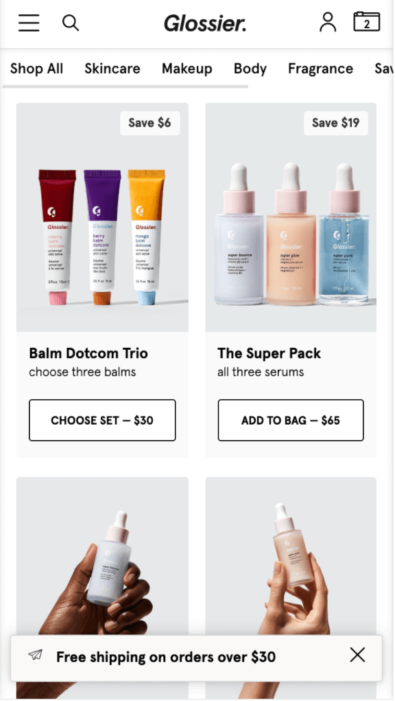 Glossier uses small badges on their PLP to advertise product-specific discounts.