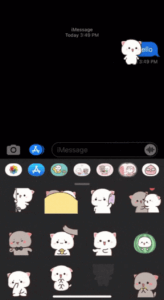 A cute, white cat sticker is placed on top of a blue, iMessage chat bubble